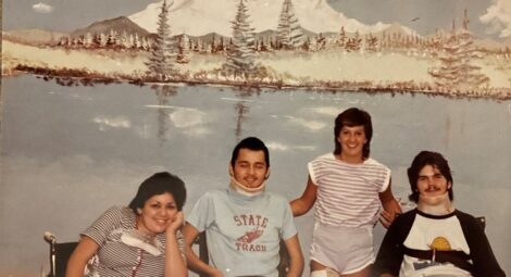 Older picture of four people posing