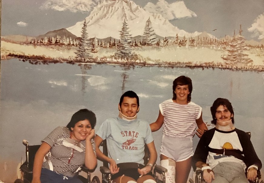 Older picture of four people posing