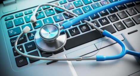 Stethoscope laying on a keyboard