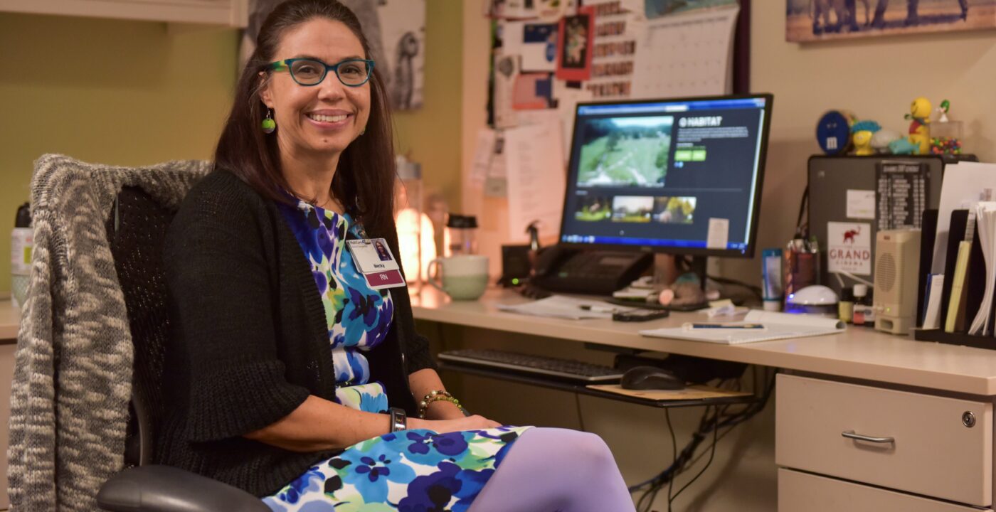Nurse navigator sitting at her desk