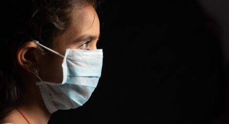 Young girl wearing face mask
