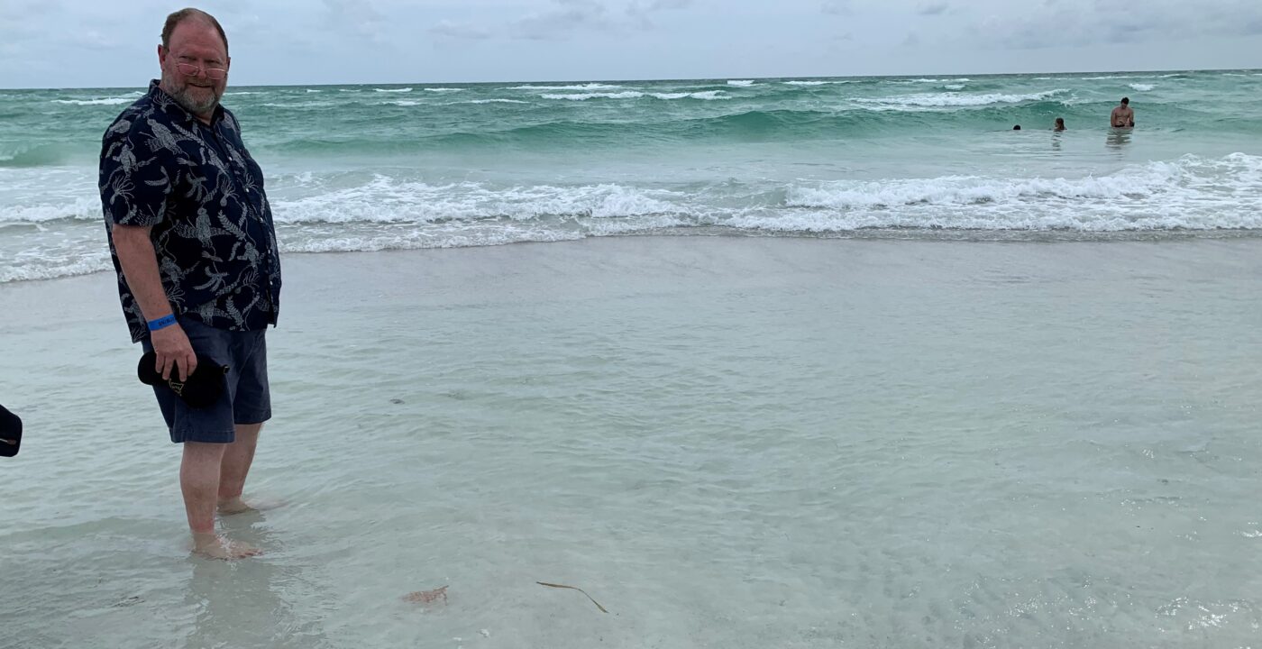 Man wadding in the ocean