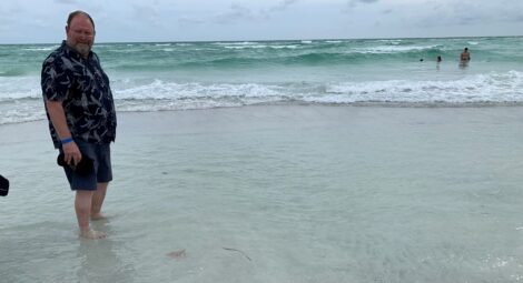 Man wadding in the ocean