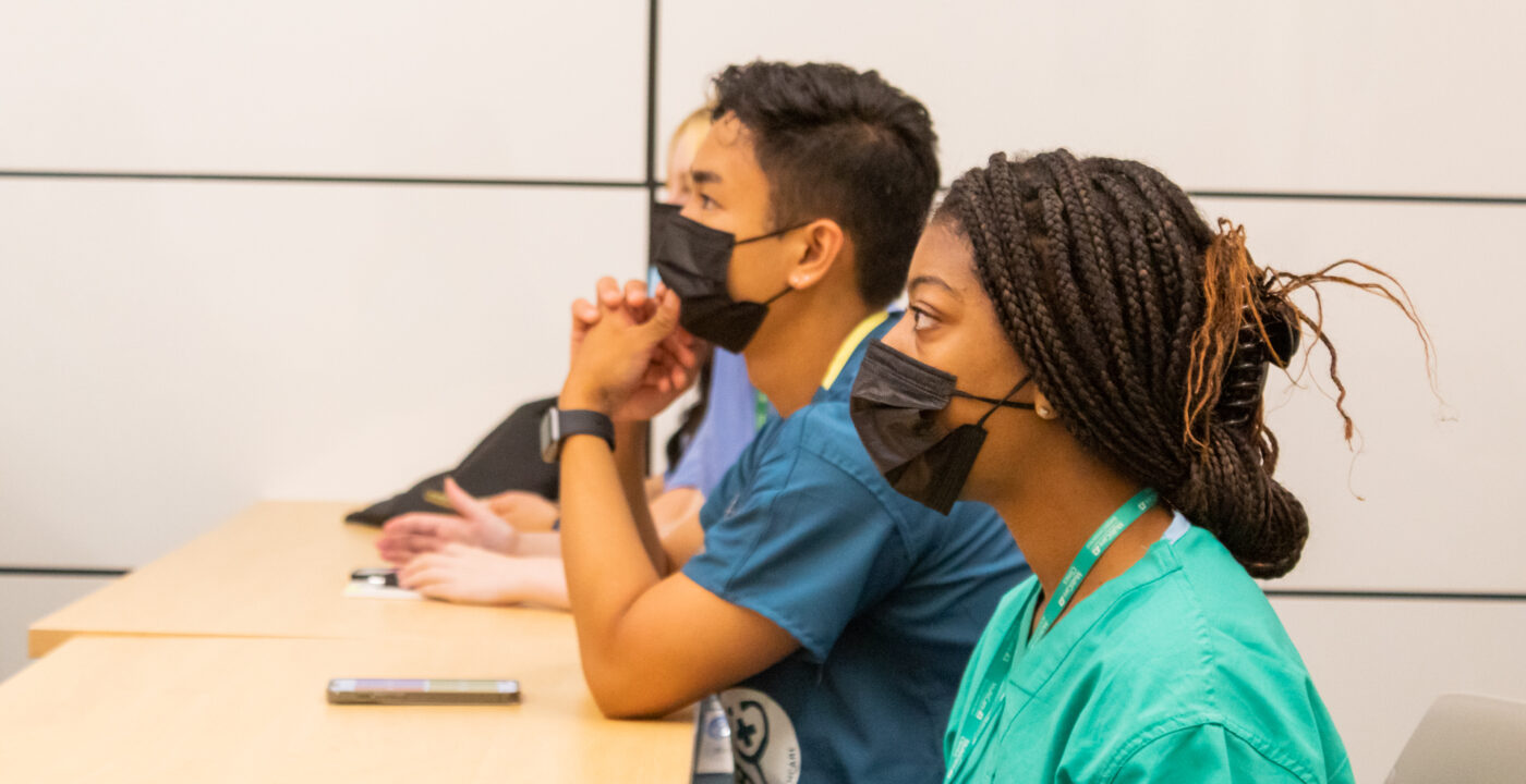 Students at a desk.