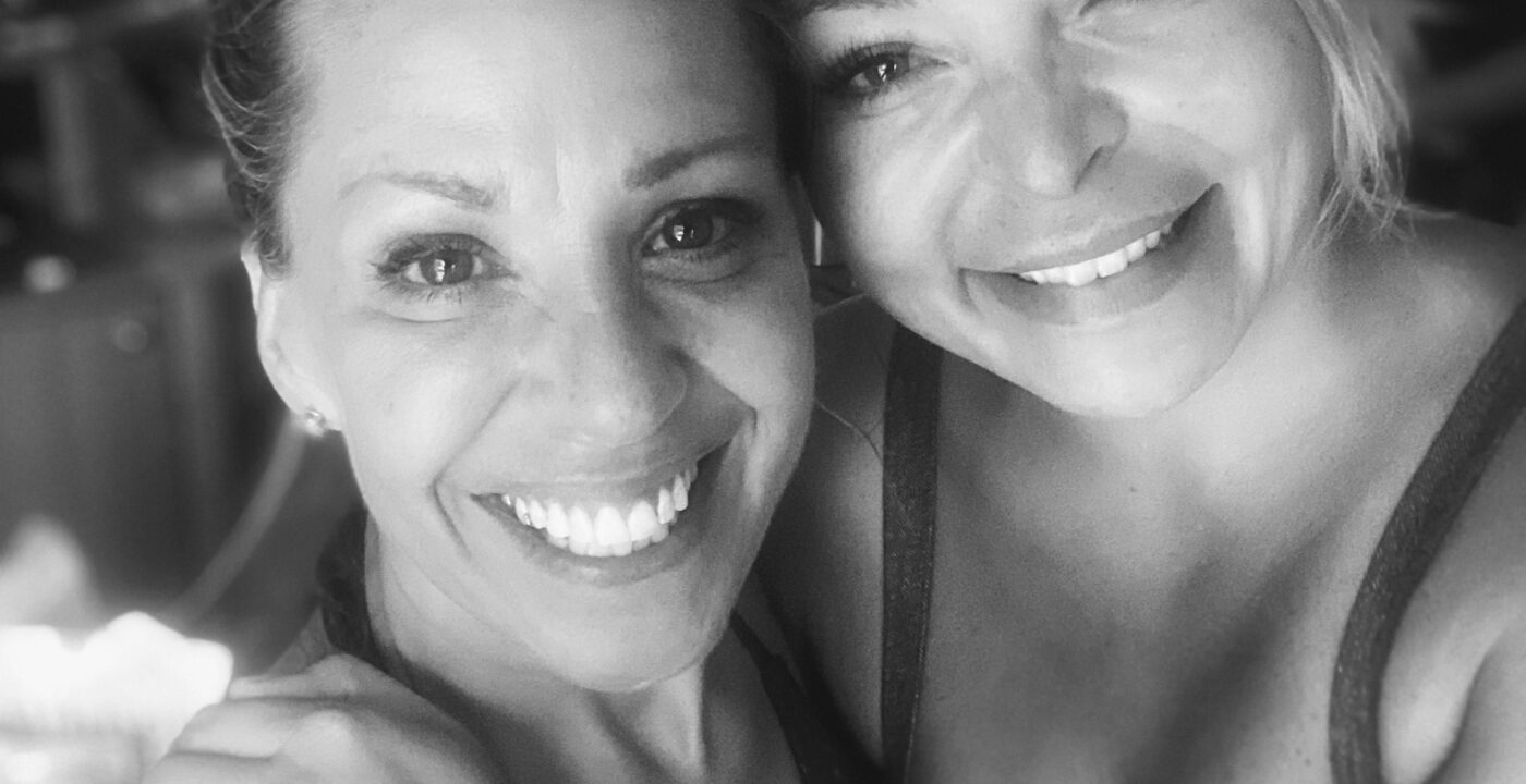Two smiling women.