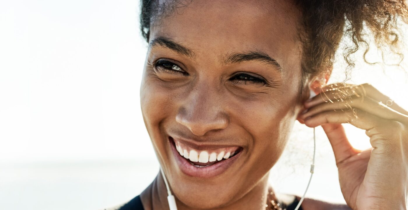 Lady smiling wearing headphones