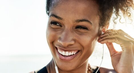 Lady smiling wearing headphones