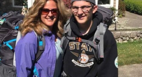 Mom and son posing for picture