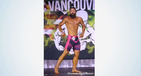 Man posing at a body builder competition.