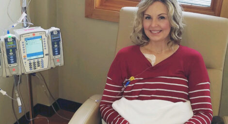 Woman sitting in a hospital chair.
