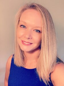 Portrait of blonde woman in blue shirt