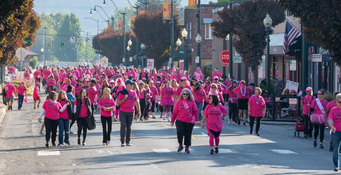Group of people wearing pink for a Breast Cancer Awareness walk.