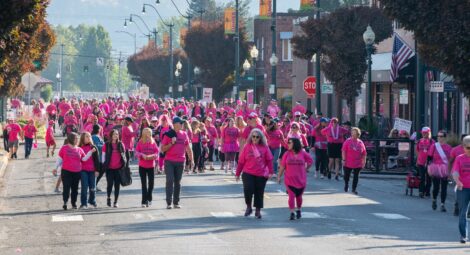 Group of people wearing pink for a Breast Cancer Awareness walk.