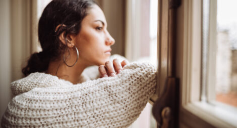 Woman staring out the window.