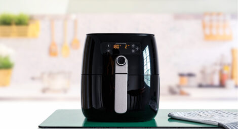 Black air fryer on kitchen counter