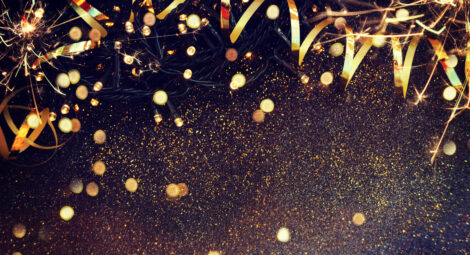 Gold ribbon, gold confetti and yellow twinkle lights