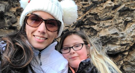 Mom and child posing for picture.