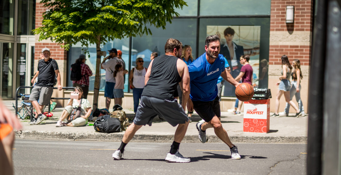 Two men playing basketball at Hoopfest tournament