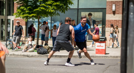 Two men playing basketball at Hoopfest tournament