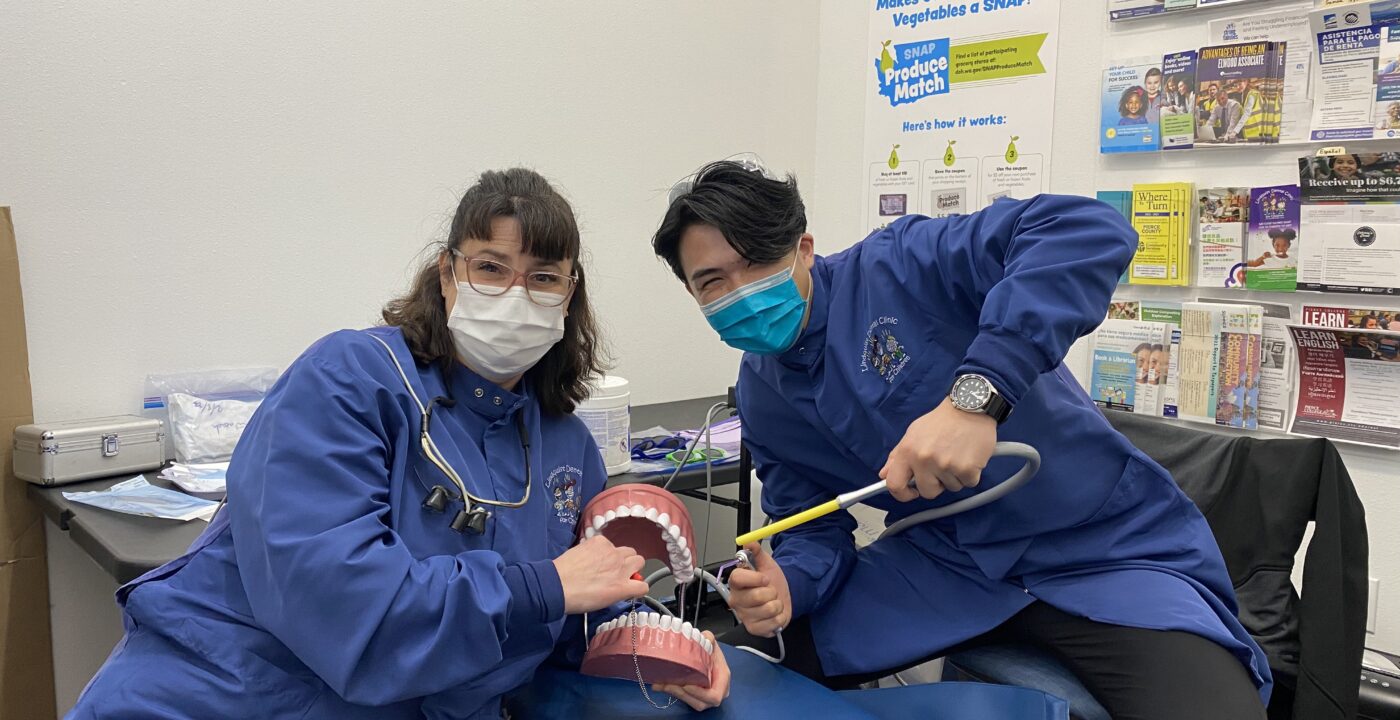 Dental providers pose with toothbrushes