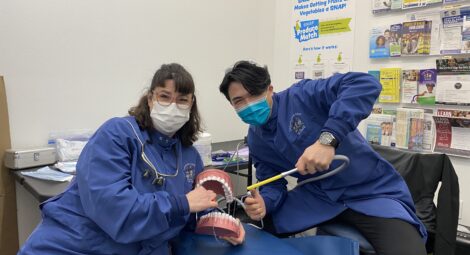 Dental providers pose with toothbrushes
