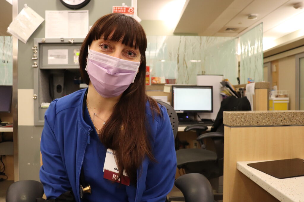 Nurse poses for a photo