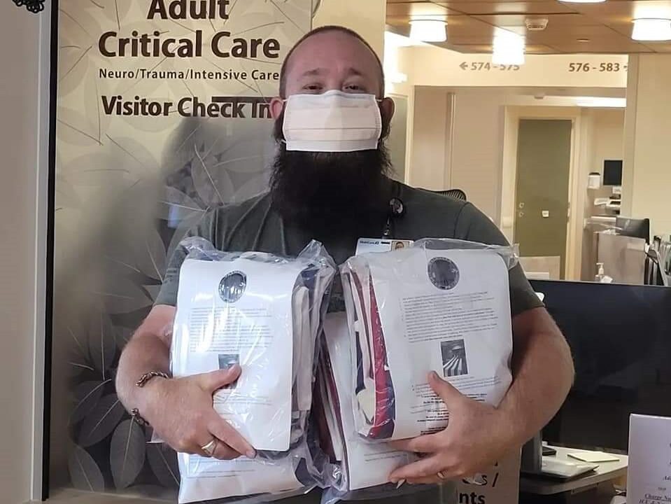 Man holds American flags in their packages.