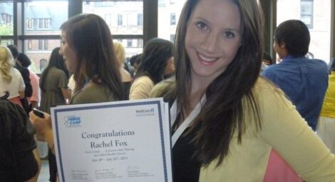 Rachel Davis holds up a certificate of completion for Nurse Camp in 2011