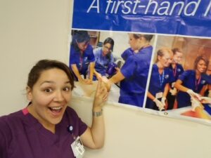 Woman pointing to sign about M.A.S.H. Camp