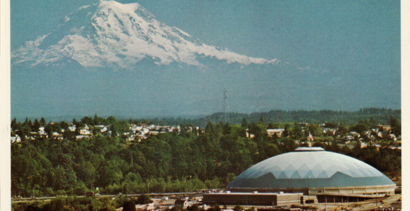 Historical photo of the Tacoma Dome with Mount Rainier in the background.