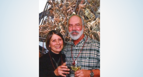 Woman and man holding wine glasses