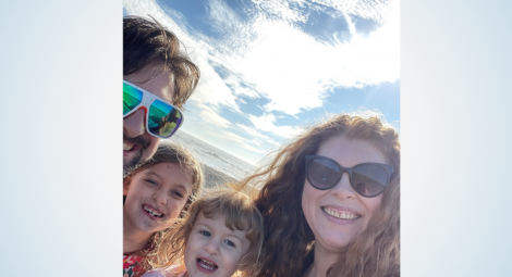 Close-up of smiling family on beach