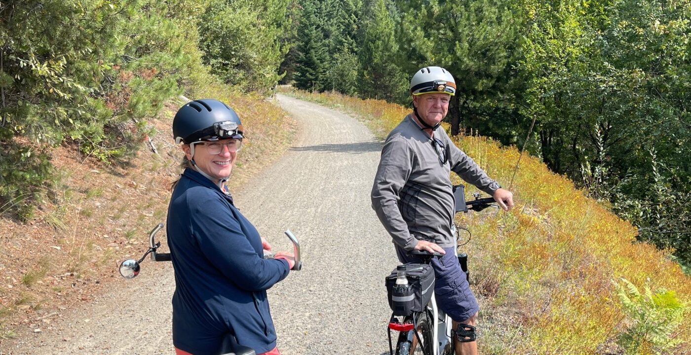 Man and woman on bike trail