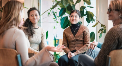 Group of women sitting in circling talking