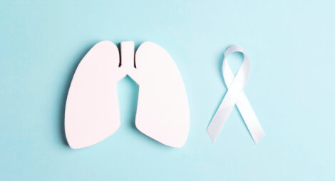 A lung and a white ribbon to recognize lung cancer