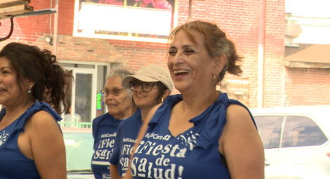 Woman smiling in a parade.