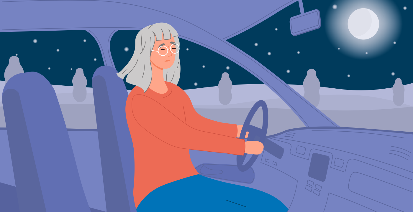 Woman driving a car at night