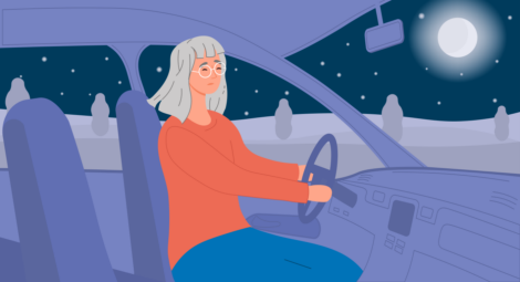 Woman driving a car at night