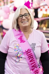 Woman in all pink at a walking event.