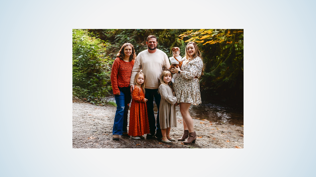Family portrait in a wooded setting