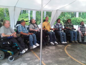 A group of men in wheelchairs.