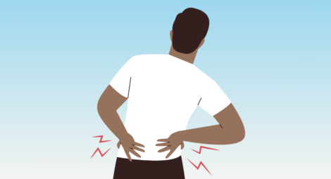 Man with hands on low back in pain