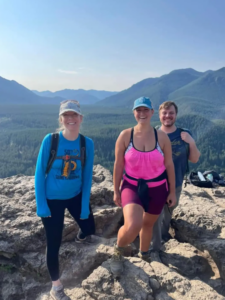 two women and one man on hike 