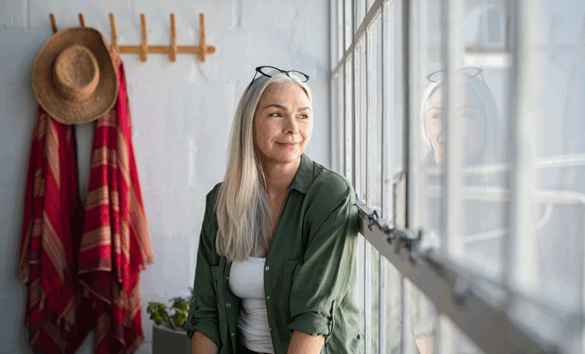 Woman looking out window