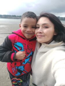Mom and son on a beach.