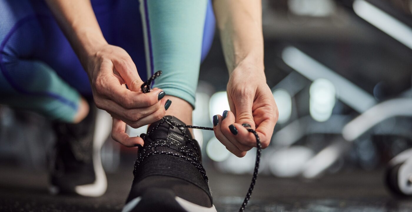 Hands tying shoelaces