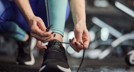 Hands tying shoelaces