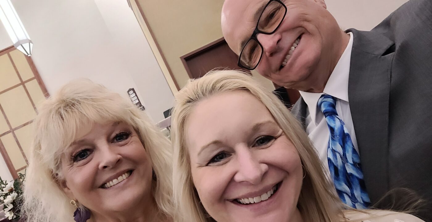 Woman and man with their adult daughter
