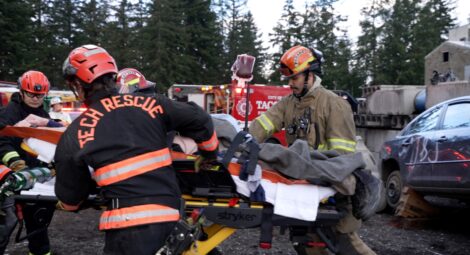 Firefighters moving a stretcher