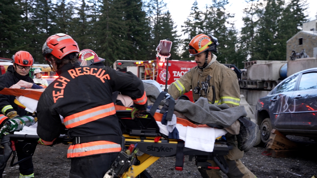 Firefighters moving a stretcher